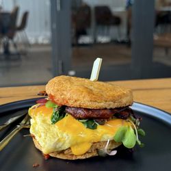 Golden Juicery - Bacon, egg, and cheese on a homemade biscuit. Added some greens to make it "healthy"