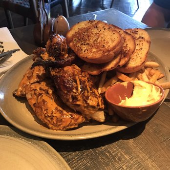 Nando's Peri-Peri - Whole chicken with garlic bread and peri fries and sauce - South African Near Me - Chicago, Illinois Nando's Peri-Peri - Whole chicken with garlic bread and peri fries and sauce - South African Near Me - Chicago, Illinois