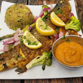 While In Kathmandu - The Trout was full of flavor. A must try! - Cafes Near Me - Ridgewood, New York