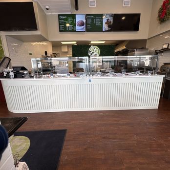 Oliveira’s Express - The ambience of the photo, the music, and vibes!! I love how the restaurant has everything named and labeled. - Brazilian Near Me - Boston, Massachusetts