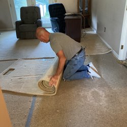 Troyer Carpets - Our installer removing old carpet