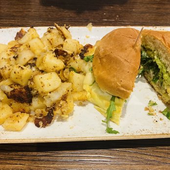 First Watch - Elevated Egg Sandwich with potatoes - Breakfast & Brunch Near Me - Cypress, Texas First Watch - Elevated Egg Sandwich with potatoes - Breakfast & Brunch Near Me - Cypress, Texas