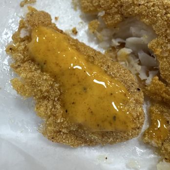 Bayou Seafood & More - A slice of fried catfish with the orange sauce - Seafood Near Me - Houston, Texas Bayou Seafood & More - A slice of fried catfish with the orange sauce - Seafood Near Me - Houston, Texas