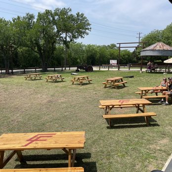 Corner BBQ Shack - Fenced off yard with benches, corn hole, and plenty of room for kids to play - Barbeque Near Me - McKinney, Texas