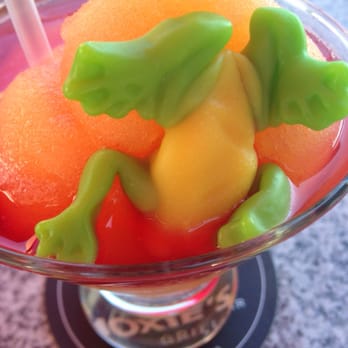 Moxies Fairview Mall Restaurant - Peach bellini with edible gummy frog! - Canadian (New) Near Me - North York, Ontario Moxies Fairview Mall Restaurant - Peach bellini with edible gummy frog! - Canadian (New) Near Me - North York, Ontario