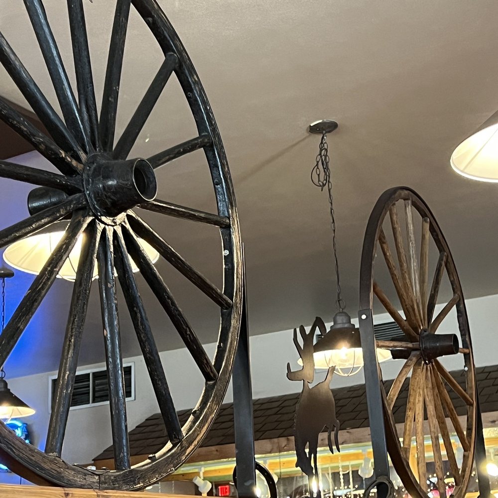 Bubba’s Bar-B-Que - ows a large wagon wheel hanging from the ceiling - Barbeque Near Me - Cody, Wyoming