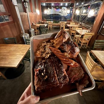 Gracie's - a person holding a tray of food - Barbeque Near Me - Vallejo, California