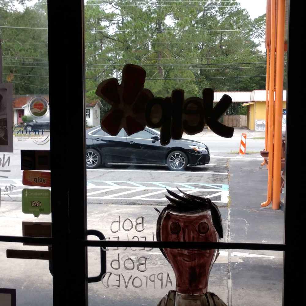 Espresso 41 - Inside of the door, showing the Yelp logo and bobs burgers(I think) character. - Coffee & Tea Near Me - Tifton, Georgia