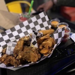 The Thirsty Chicken - Lemon pepper and Cajun dry rub with wedges and a fried pickle