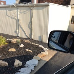 Wendy's - Rock garden with biblical sayings on them in drive through line.