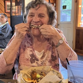 George Henry's - Someone is loving every morsel of her garlic parmesan wings! A favorite of my grandmas back in the day. - Pubs Near Me - Warrensburg, New York George Henry's - Someone is loving every morsel of her garlic parmesan wings! A favorite of my grandmas back in the day. - Pubs Near Me - Warrensburg, New York