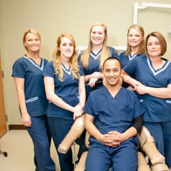 Nashua Oral Surgery Associates - Some of our clinical staff pose in one of Nashua's bright treatment rooms.