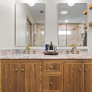 Pink Cube Development - Wood double vanity remodel with marble countertop and brass faucets - General Contractors Near Me Pink Cube Development - Wood double vanity remodel with marble countertop and brass faucets - General Contractors Near Me