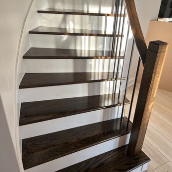 Stone & Grain Design Group - The finished staircase, with new treads, posts, and curved handrail. - Interior Design Near Me Stone & Grain Design Group - The finished staircase, with new treads, posts, and curved handrail. - Interior Design Near Me