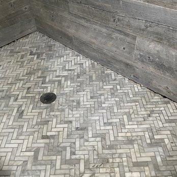 HT Constructions - shower pan sinked from weakened wood floor. - General Contractors Near Me