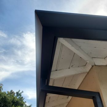 Anaheim Rain Gutter - Black angle faced with custom drops. - Gutter Services Near Me