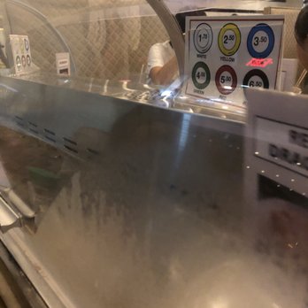 Ushio Sushi - Conveyor belt next to table and prices by plate color - Sushi Bars Near Me - Davie, Florida Ushio Sushi - Conveyor belt next to table and prices by plate color - Sushi Bars Near Me - Davie, Florida