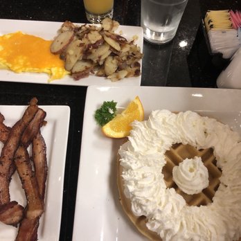 Keke's Breakfast Cafe - Belgium Waffle, home potatoes, eggs and cheese and delicious bacon. - Breakfast & Brunch Near Me - Clermont, Florida Keke's Breakfast Cafe - Belgium Waffle, home potatoes, eggs and cheese and delicious bacon. - Breakfast & Brunch Near Me - Clermont, Florida