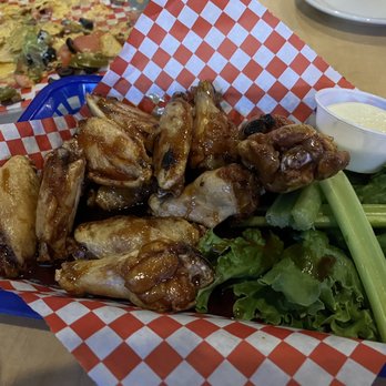 Blue Coyote Bar and Grill - Chicken wings (sauce sliding off) - American Near Me - Truckee, California Blue Coyote Bar and Grill - Chicken wings (sauce sliding off) - American Near Me - Truckee, California