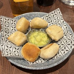 Garlic dough balls with garlic/butter dipping sauce. Garlic dough balls with garlic/butter dipping sauce.