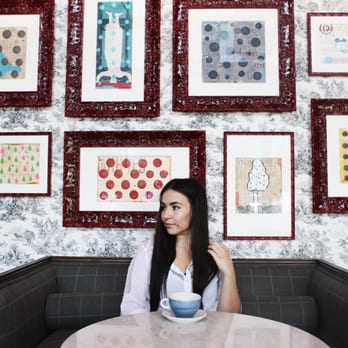 The Henry - Augustina enjoys a latte in the salon of "The Greatest Neighborhood Restaurant." Photo collaboration with eatsandsights.com. - New American Near Me - Phoenix, Arizona