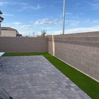 EG Landscape - a patio with artificial grass - Landscaping Near Me