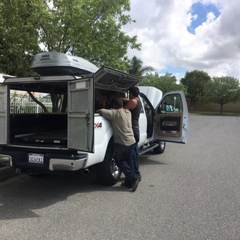 Serrato's Towing & Roadside Service - Here's they're helping install our old truck cap. - Roadside Assistance Near Me