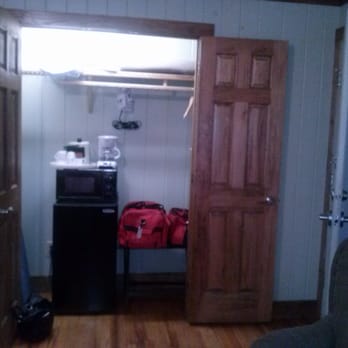 The Village Inn - Closet with micro-fridge, coffee maker, iron, ironing board. No space for making coffee on top of microwave - Hotels Near Me - Blowing Rock, North Carolina