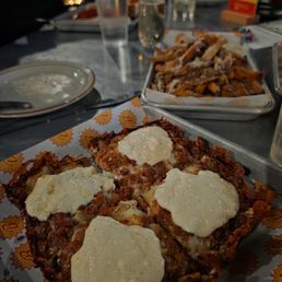 Artie Bucco pizza and Parmesan fries