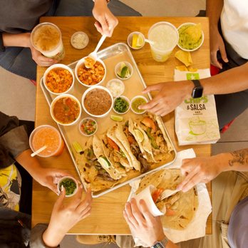 Laredo Taco - a table full of tacos - Tacos Near Me - Rosenberg, Texas
