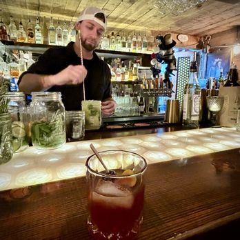 Velvet - The bartender hand crafting out drinks. - Lounges Near Me - Bend, Oregon