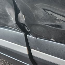 Quick Stop Muffler & Brake Shop - Damage to both front and rear doors.