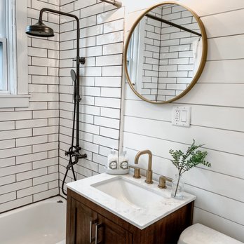 Jimenez Landscaping and Construction - a bathroom with white subway walls - General Contractors Near Me - Kingston, New York