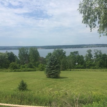 Tom Thumb Drive-In - a view of a lake and a grassy field - Ice Cream & Frozen Yogurt Near Me - Auburn, New York