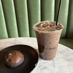 Black mocha latte with housemade almond coconut milk and 3 shots with Chocolate Banana Cake GF