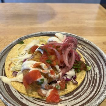 California Fish Grill - Fish taco...don't let the crema portion fool you. It was delicious! - Seafood Near Me - Costa Mesa, California