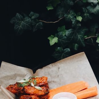 Union Hall - Classic Buffalo-style wings with house gorgonzola ranch on the side, celery and carrots - Pubs Near Me - Brooklyn, New York Union Hall - Classic Buffalo-style wings with house gorgonzola ranch on the side, celery and carrots - Pubs Near Me - Brooklyn, New York