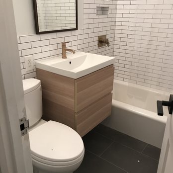 Rahim Home Improvement - a bathroom with a sink, toilet, and bathtub - General Contractors Near Me Rahim Home Improvement - a bathroom with a sink, toilet, and bathtub - General Contractors Near Me