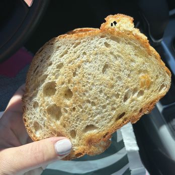 Starbucks - a person holding a piece of bread - Coffee & Tea Near Me - Clinton Twp, Michigan Starbucks - a person holding a piece of bread - Coffee & Tea Near Me - Clinton Twp, Michigan