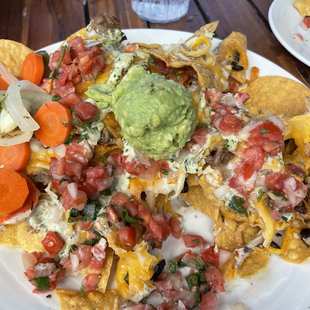 Duke's Beach House - Kalua pork nachos. Couldn't get a shot of it before hubby started destroying them but nachos worth it!! - Breakfast & Brunch Near Me - Lahaina, Hawaii Duke's Beach House - Kalua pork nachos. Couldn't get a shot of it before hubby started destroying them but nachos worth it!! - Breakfast & Brunch Near Me - Lahaina, Hawaii