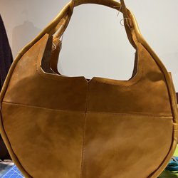 Tandy Leather Factory - In progress leather round bag with piping on the edges.