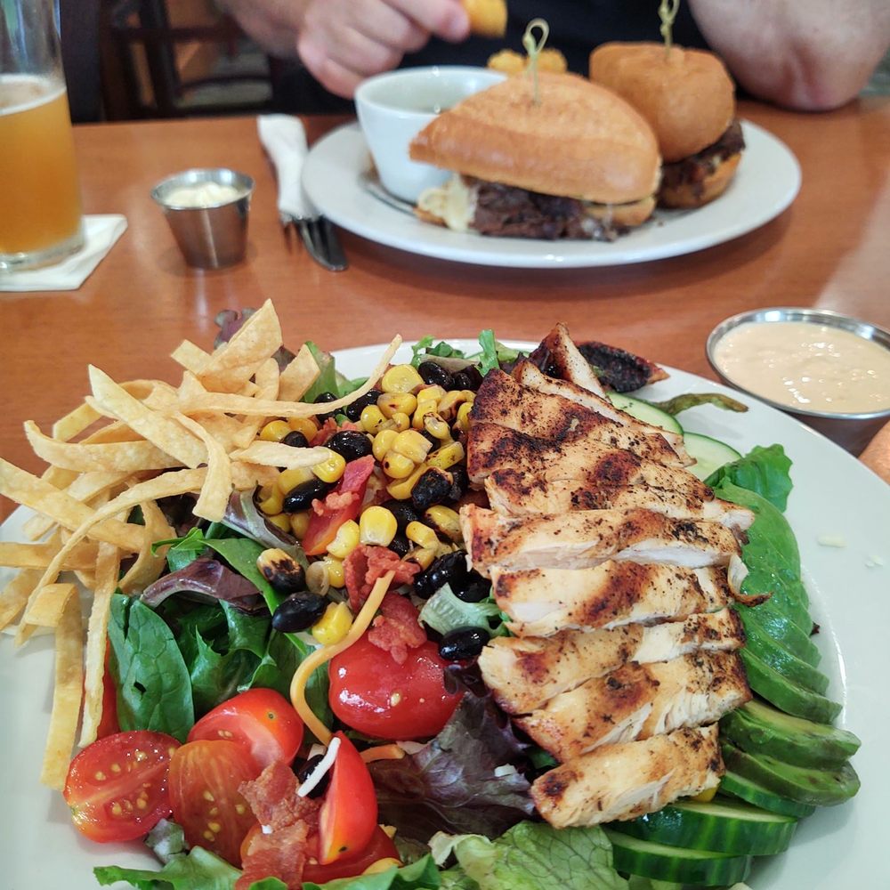 The southwest chicken salad and prime rib sandwich with tater tots The southwest chicken salad and prime rib sandwich with tater tots