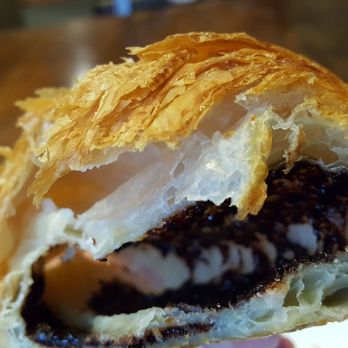Grand Pere Bakery - Four bites, big gaping space but coated with chocolate. Tasty, just not tighter laminated layers (12/28/18) - Bakeries Near Me - Mountlake Terrace, Washington Grand Pere Bakery - Four bites, big gaping space but coated with chocolate. Tasty, just not tighter laminated layers (12/28/18) - Bakeries Near Me - Mountlake Terrace, Washington