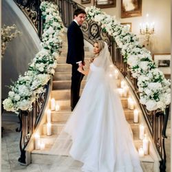 Blooming Brides - This gorgeous staircase embellished with all white florals enhances the space beautifully @Park Chateau