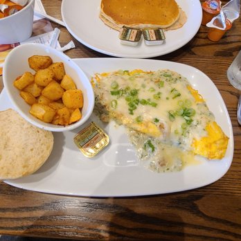 Another Broken Egg Cafe - Floridian omelette, country potatoes, english muffin, and buttermilk pancake on the side. - American Near Me - Austin, Texas Another Broken Egg Cafe - Floridian omelette, country potatoes, english muffin, and buttermilk pancake on the side. - American Near Me - Austin, Texas