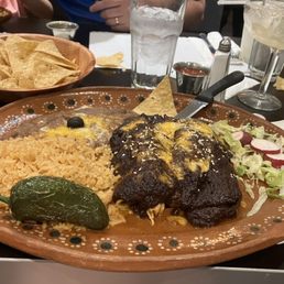 Mole enchiladas: not spicy per say, but certainly more heat than anywhere else I've had this item. Mole enchiladas: not spicy per say, but certainly more heat than anywhere else I've had this item.