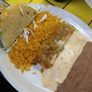 Posados - Shredded beef hard taco, pork tamal, and a cheese enchilada with green chilies sauce - Mexican Near Me - Longview, Texas Posados - Shredded beef hard taco, pork tamal, and a cheese enchilada with green chilies sauce - Mexican Near Me - Longview, Texas