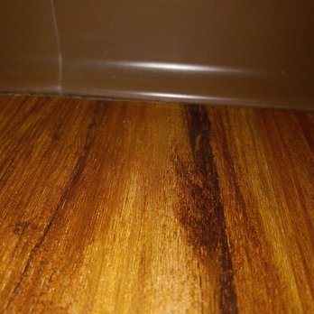 Syracuse Flooring America - Short cut under baseboard, you can see space, top left near joint - Carpeting Near Me - Syracuse, New York Syracuse Flooring America - Short cut under baseboard, you can see space, top left near joint - Carpeting Near Me - Syracuse, New York