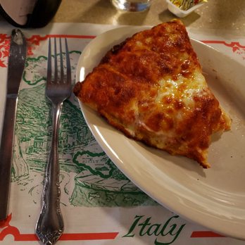 Luigi's Restaurant - They call this a generous slice of pizza!!! Lmbo!!! Also a little overdone! I prefer white cheese over brown cheese. - Pizza Near Me - Akron, Ohio Luigi's Restaurant - They call this a generous slice of pizza!!! Lmbo!!! Also a little overdone! I prefer white cheese over brown cheese. - Pizza Near Me - Akron, Ohio