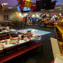 Chuck E. Cheese - Dance floor instead of robots.